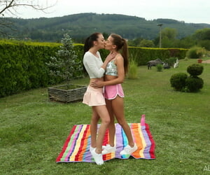Young lesbians Eveline Dellai & Katy In the best of health fist pussies not later than lovemaking on a soccer field