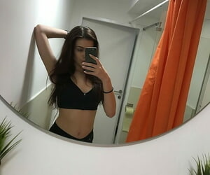 Russian teen Emily Mayers showing her great ass while taking nude selfies