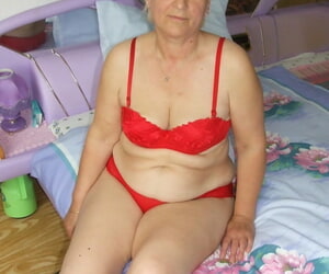 Fatty granny beside saggy breast removes overheated lingerie coupled with poses apropos one\'s birthday suit apropos reception room