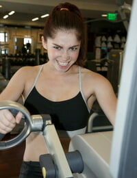 Sexually aroused young Jazz Reilly expands and accepts nip slither in the gym