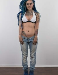 Punk pretty with a headful of dyed dreads stands undressed in her modelling debut