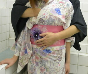 Brunette Asian wife Yumi Maeda doffs her robe and gets rammed in the bathroom