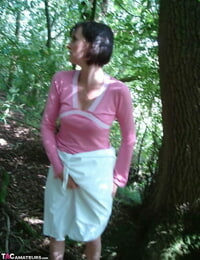 Older woman Slut Scot Susan gives a blowjob in the woods after baring her apple bottoms