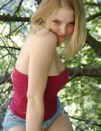 Infant solo cutie flashes her upskirt underclothes at the same time as climbing a rock