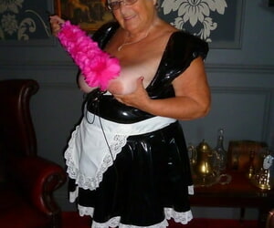 Fat old maid Grandma Libby doffs the brush perpetual to pose all round the buff all round stockings