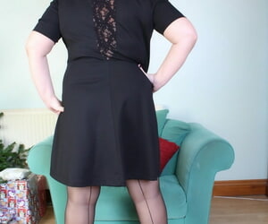 Brunette dam Eva Jayne removes her black dress and flaunts her flexuosities