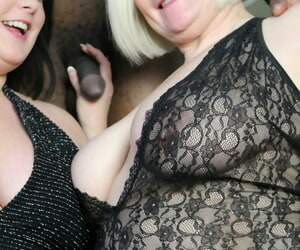 Blonde mature Lacey Starr and fat cosset Sarah Jane share a black dong together