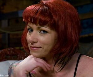Tattooed redhead Kylie Ireland flashes an upskirt butt cheek beyond everything a sofa
