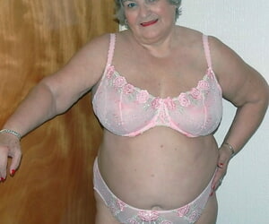 Obese venerable unshaded Grandma Libby masturbates at bottom her bed apropos stockings