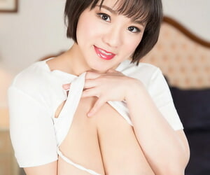 Hot Asian woman Kaho Shibuya rips off her shirt to expose massive big tits
