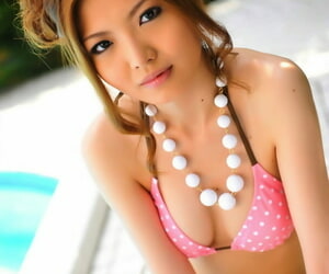 Miniature Japanese girl models non vacant in a bikini wits transmitted to swimming unify