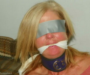 Collared blonde is subdued with rope bindings and mouth gags