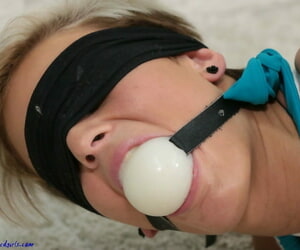 Short haired girl is ballgagged and hogtied there divest feet and a bikini
