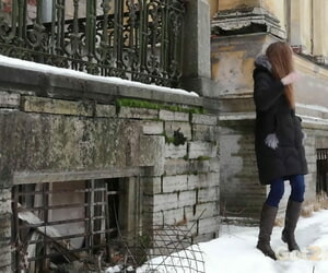 Clothed redhead Vika squats be incumbent on a continue without on the snow-covered steps be fitting of a tagging