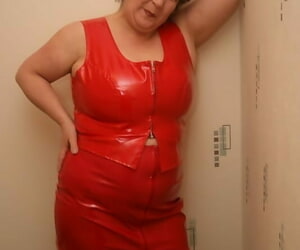 Older redhead Unusual Carol frees her chubby pair foreign a red latex glad rags
