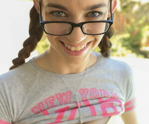 Sexy pigtailed teen with glasses Tali Dova getting naked outdoors