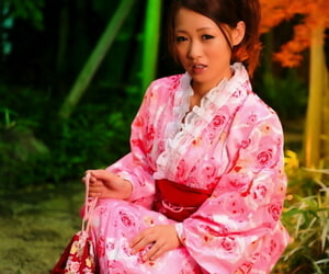 Japanese geisha lets a breast escape from a traditional kimono