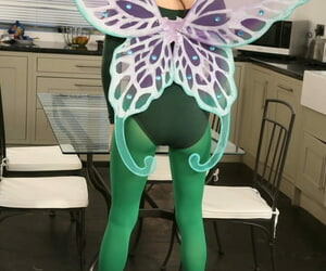 Beautiful babe in fairy costume Laura H reveals her big tits while posing