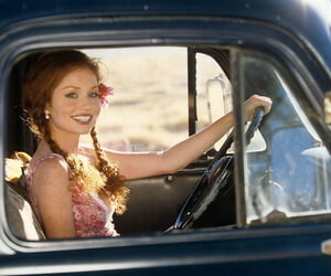 Irresistible redhead beauty Scarlett Keegan shows uncomplicated knockers far farm truck