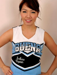 Juvenile Japanese solo doll sheds cheerleader uniform to exposed insignificant infant scoops