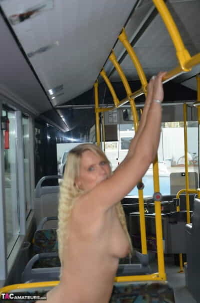 Thick blond chick takes off her underwear to pose naked in socks on a city bus