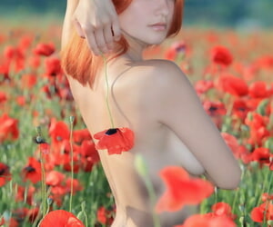 Hot redhead Violla A undressing in field to show small saggy tits & tight ass