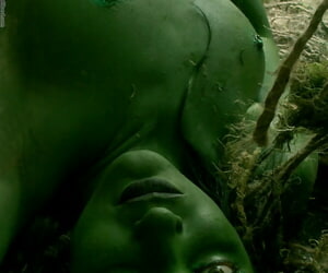 Solo girl with green skin wanders around the woods with no clothes on