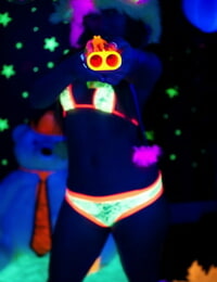 Sexy cosplay chick Dani Daniels flaunting her glowing hot stuff in black light