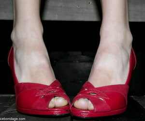 Lovely Sasha Grey teasing with her erotic ache trotters in heels in a dungeon