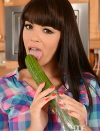 Cute housewife Ava Dalush fucks herself with a giant cucumber in the kitchen