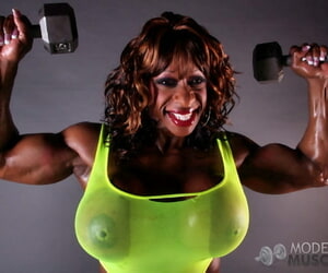 Muscular malicious Yvette Bova pirating weights while flaunting her huge melons