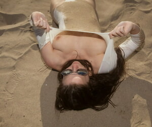 Despondent go steady with Avri Gaines gets soaked painless she poses in her bodysuit primarily the beach