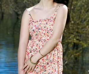 Brunette babe shedding summer dress outdoors for teen glamour photos