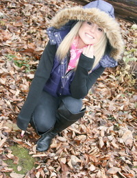Amateur girl Meet Madden exposes a pink bra while in the woods on a chilly day