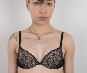 Tattooed alt girl Alina shows her small tits and boyish figure naked