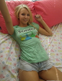 Alluring golden-haired juvenile snaps self shots of her in nature\'s garb bazookas in cutoff jean panties