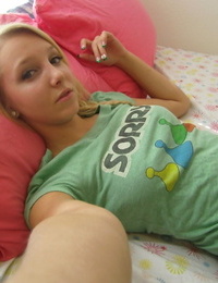 Cute blonde adolescent snaps self shots of her bare boobs in cutoff jean shorts