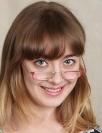 Juvenile model Emily Johnson swelling vagina lips wide on the desk for closeup