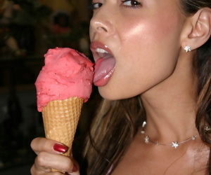 Asian model Tera Patrick licks put away cream cone in white latex chef