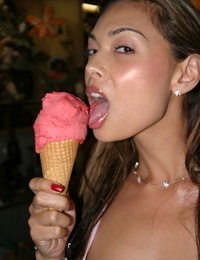 Asian model Tera Patrick licks ice cream cone in white latex boots