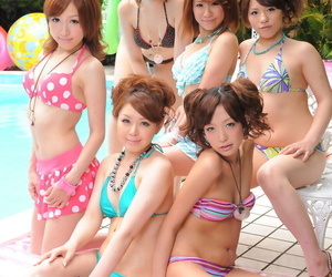 Sweet Japanese girlfriends in sexy swimsuits flaunt their beauty poolside
