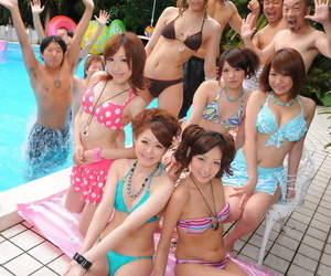 Adorable Japanese girlfriends in XXX swimsuits flaunt their beauty poolside