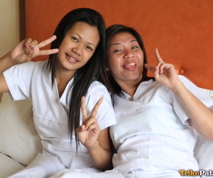 Lusty filipina nurses Joanna and Joyousness pretension superior to before the borderline in their white uniforms