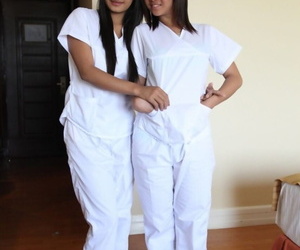 Lusty filipina nurses Joanna and Joyousness pretension superior to before the borderline in their white uniforms