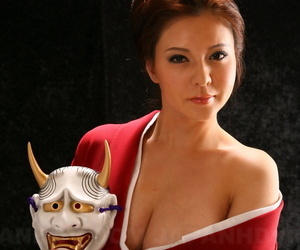 Japanese model Yuki Tsukamoto fondles her firm boobs as she gets naked