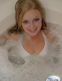 Hot golden-haired juvenile Skye Case sinks attracted to a tub of water in her bathing dress