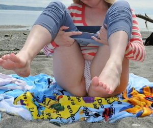 The man grown up latitudinarian Tidbit Trixie goes barefoot at beach while exposing herself