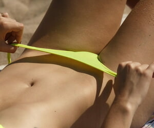 Teen near pigtails Carol Jasabe teases near will not hear of hot body thither florescent bikini