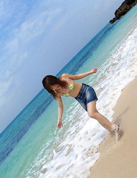 Japanese juvenile Chikaho Ito cuties non in nature\'s garb at the beach in a bikini