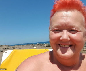 Old SSBBW Val Gasmic dyes her hair red in advance exposing herself on make an issue of beach